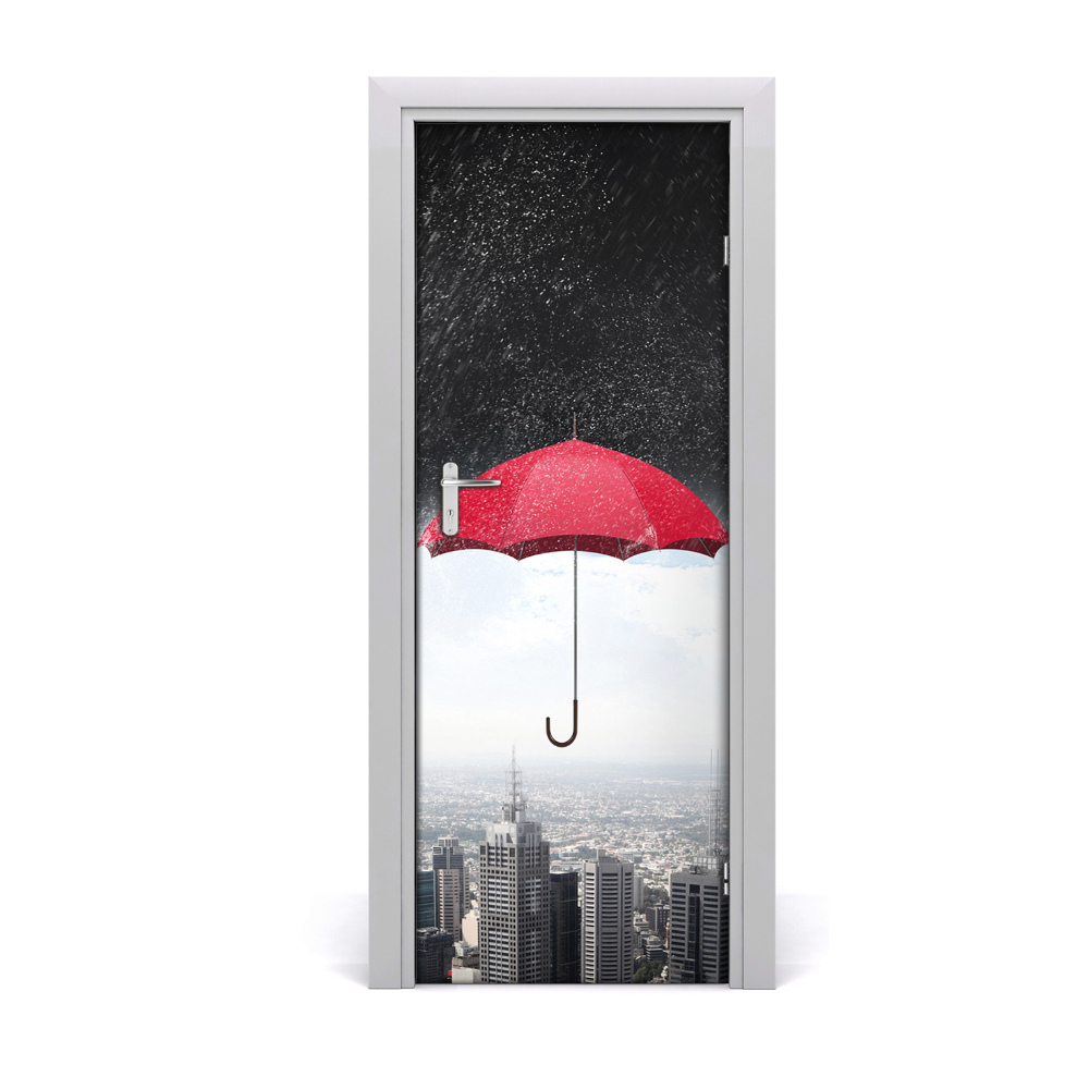 Fototapeta samoprzylepna drzwi Czerwony parasol nad miastem