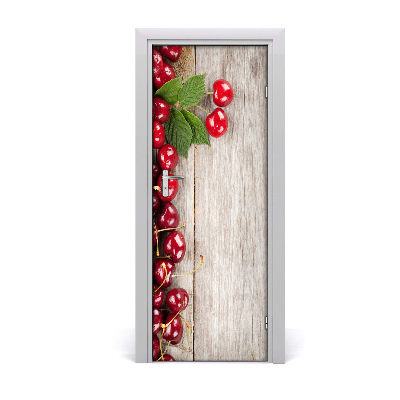 Naklejka na drzwi do domu samoprzylepna Wiśnie na stole