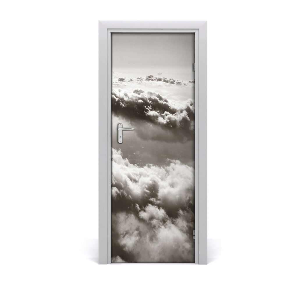 Naklejka fototapeta na drzwi Lot nad szarymi chmurami