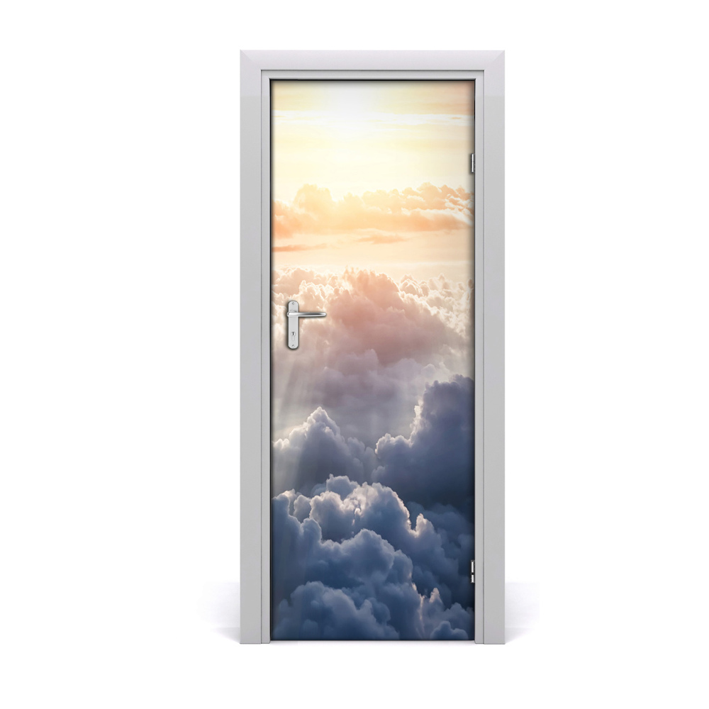 Naklejka fototapeta na drzwi Lot nad pastelowymi chmurami