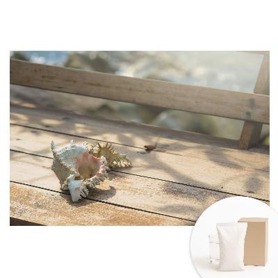 Fototapeta flizelinowa Muszla na drewnianej ławce