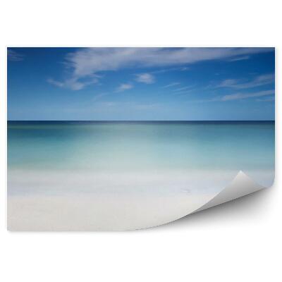 Fototapeta Piaszczysta plaża ocean niebo chmury