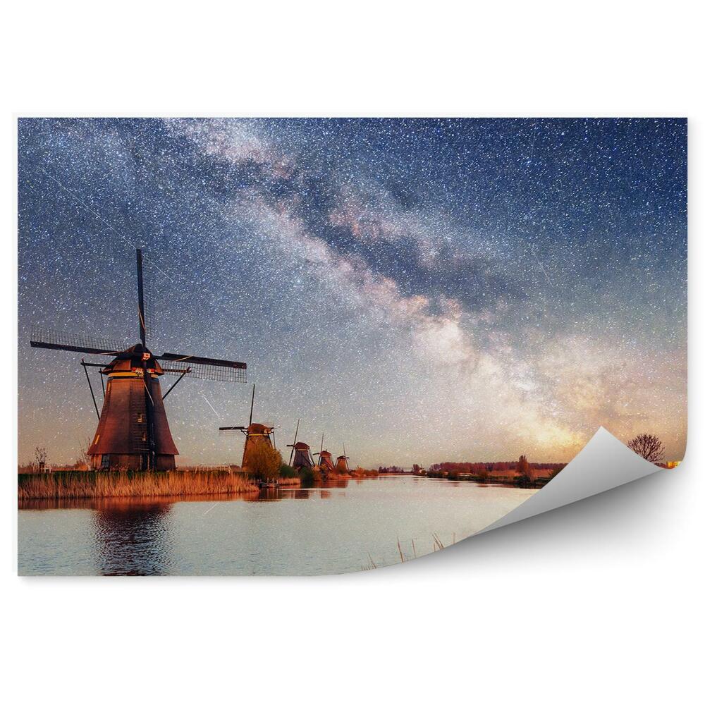 Fototapeta Holenderskie młyny niebo jezioro trawy gwiaździste niebo galaktyka droga mleczna spadające gwiazdy