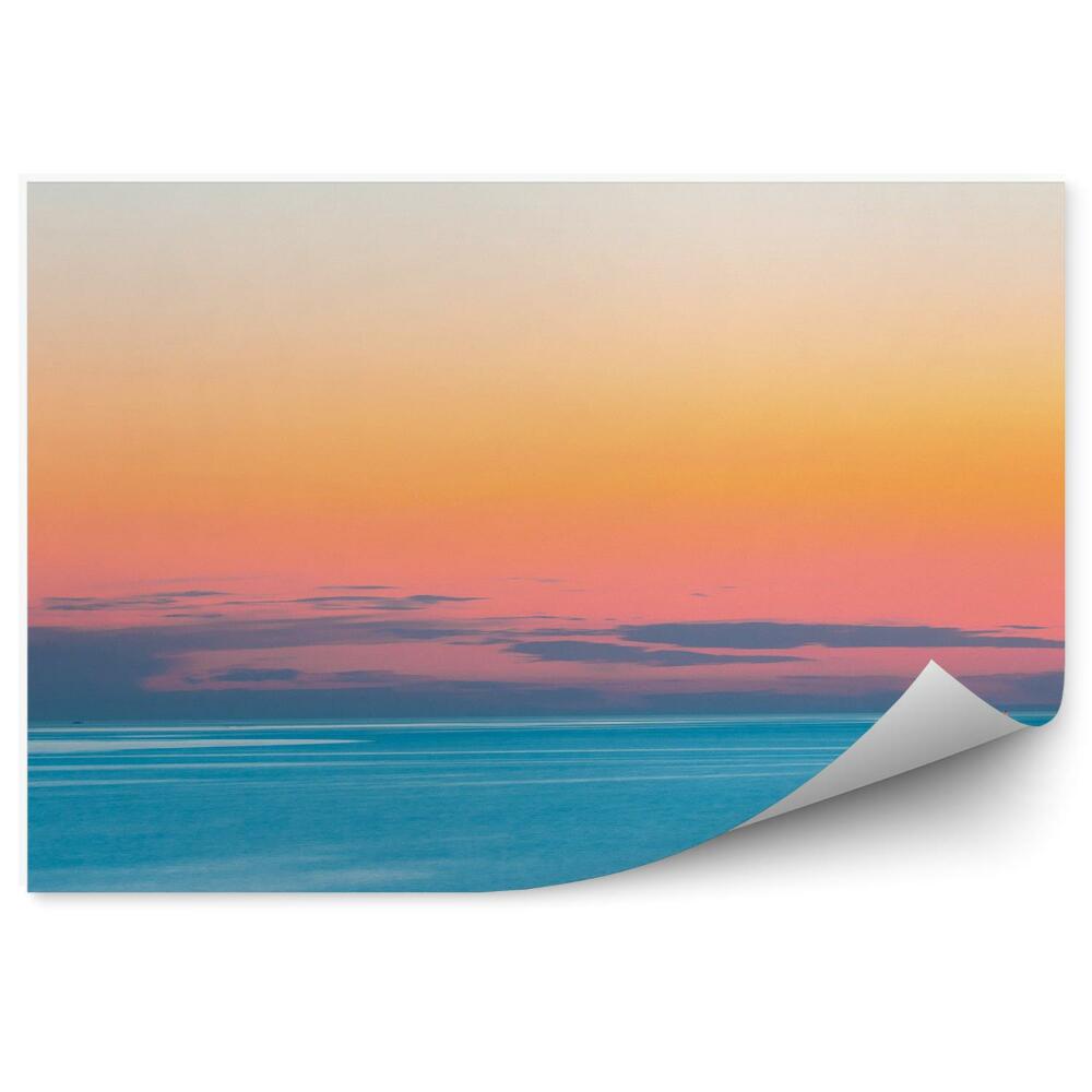 Fototapeta Spokojne morze zachód słońca chmury