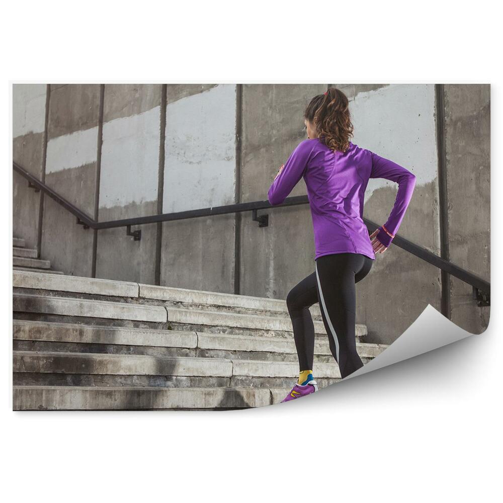 Fototapeta samoprzylepna Bieganie po schodach sport fitness mur