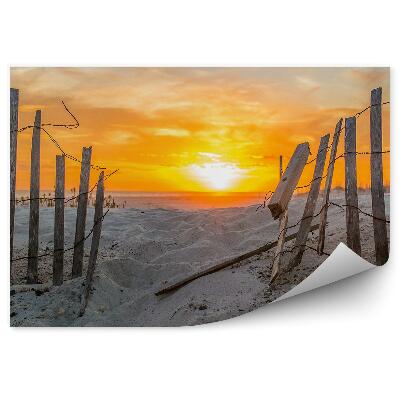 Fototapeta Płotek kamienie plaża zachód słońca niebo