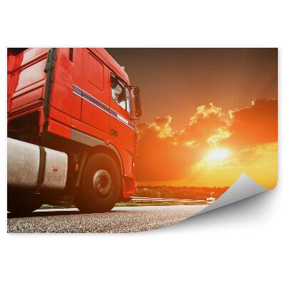 Fototapeta na ścianę Czerwona ciężarówka w tle zachód słońca