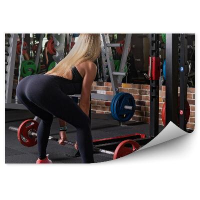 Fototapeta samoprzylepna Kobieta siłownia podnoszenie ciężarów