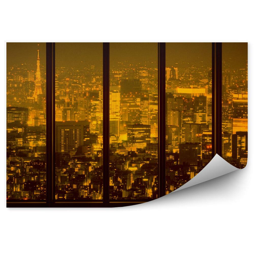 Fototapeta na ścianę Oświetlone miasto nocą widok przez okno
