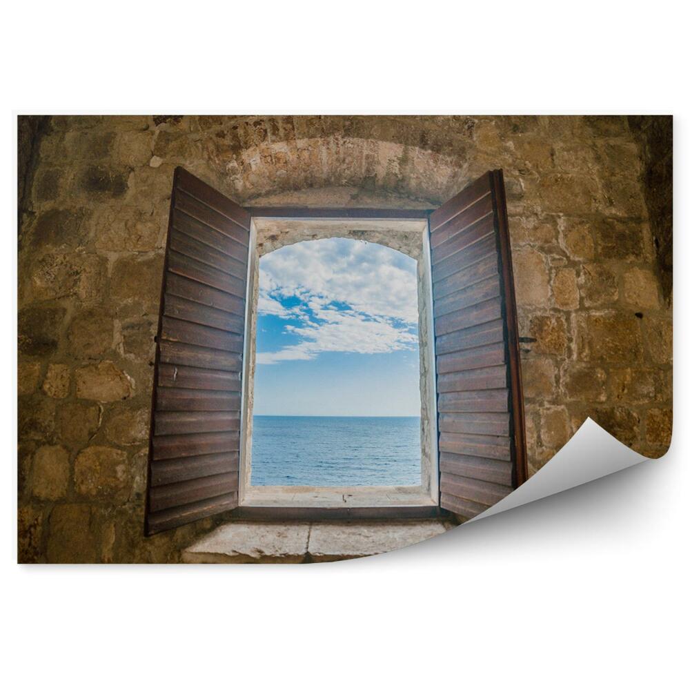 Fototapeta na ścianę Okno w murze starego fortu widok na morze