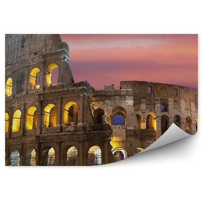 Okleina na ścianę Oświetlone koloseum na tle kolorowego nieba