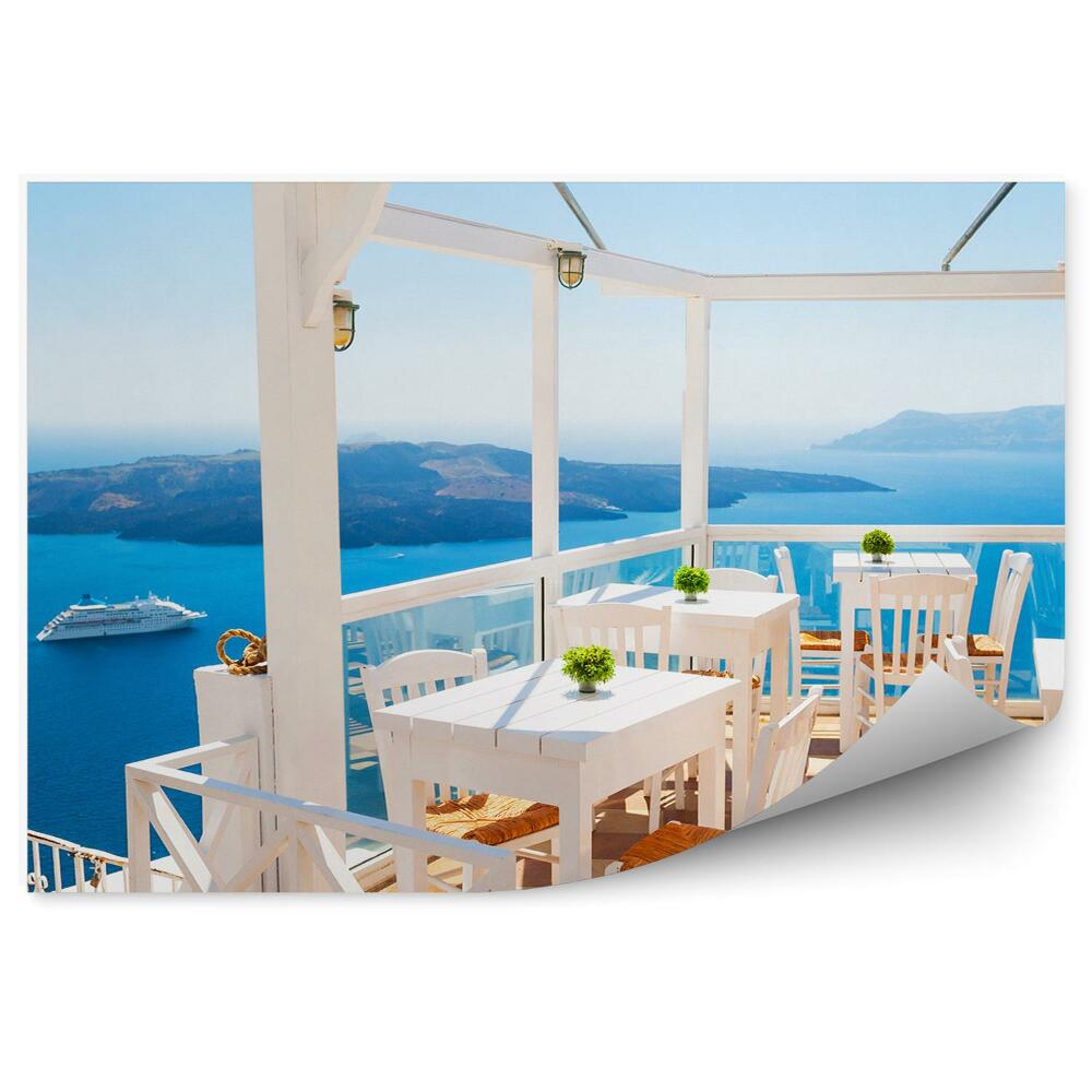 Fototapeta taras krzesła stoły morze jachty góry Santorini Grecja