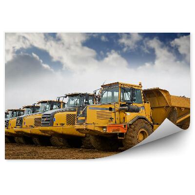 Fototapeta na ścianę Rząd wywrotek na tle nieba