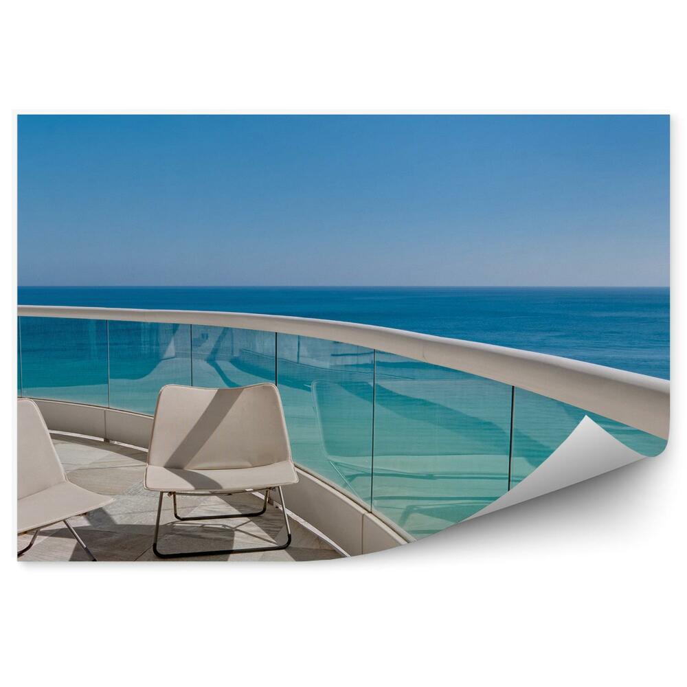 Fototapeta Balkon z widokiem na ocean leżaki piasek widok szkło