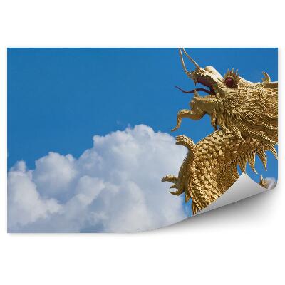 Okleina ścienna Złoty smok latający wśród chmur na błękitnym niebie