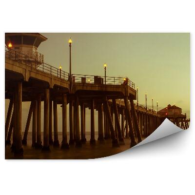 Fototapeta samoprzylepna Betonowe molo woda sepia światła