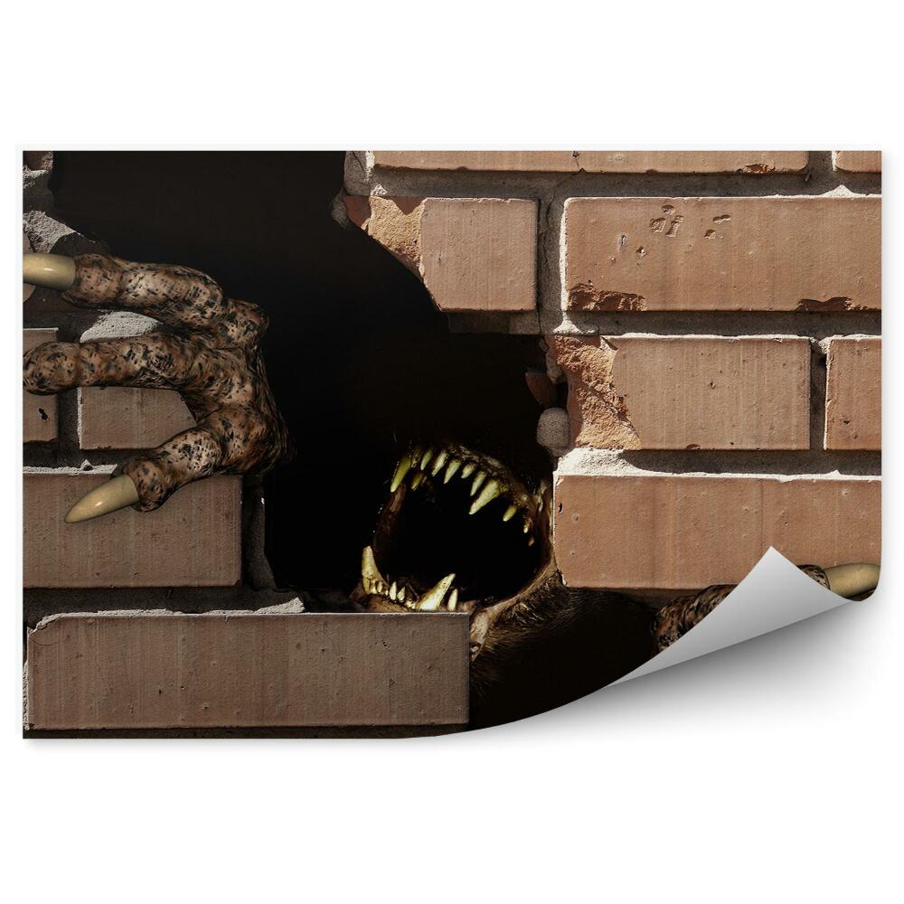 Fototapeta samoprzylepna Łapy potwora w wyrwie w ceglanej ścianie