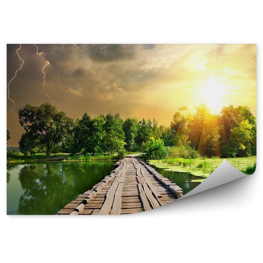 Okleina ścienna Drewniany most jezioro drzewa niebo chmury burza zachód słońca