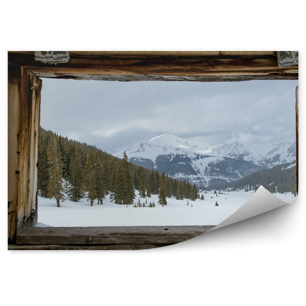 Fototapeta Okno w drewnianej chacie zima las choinki góry