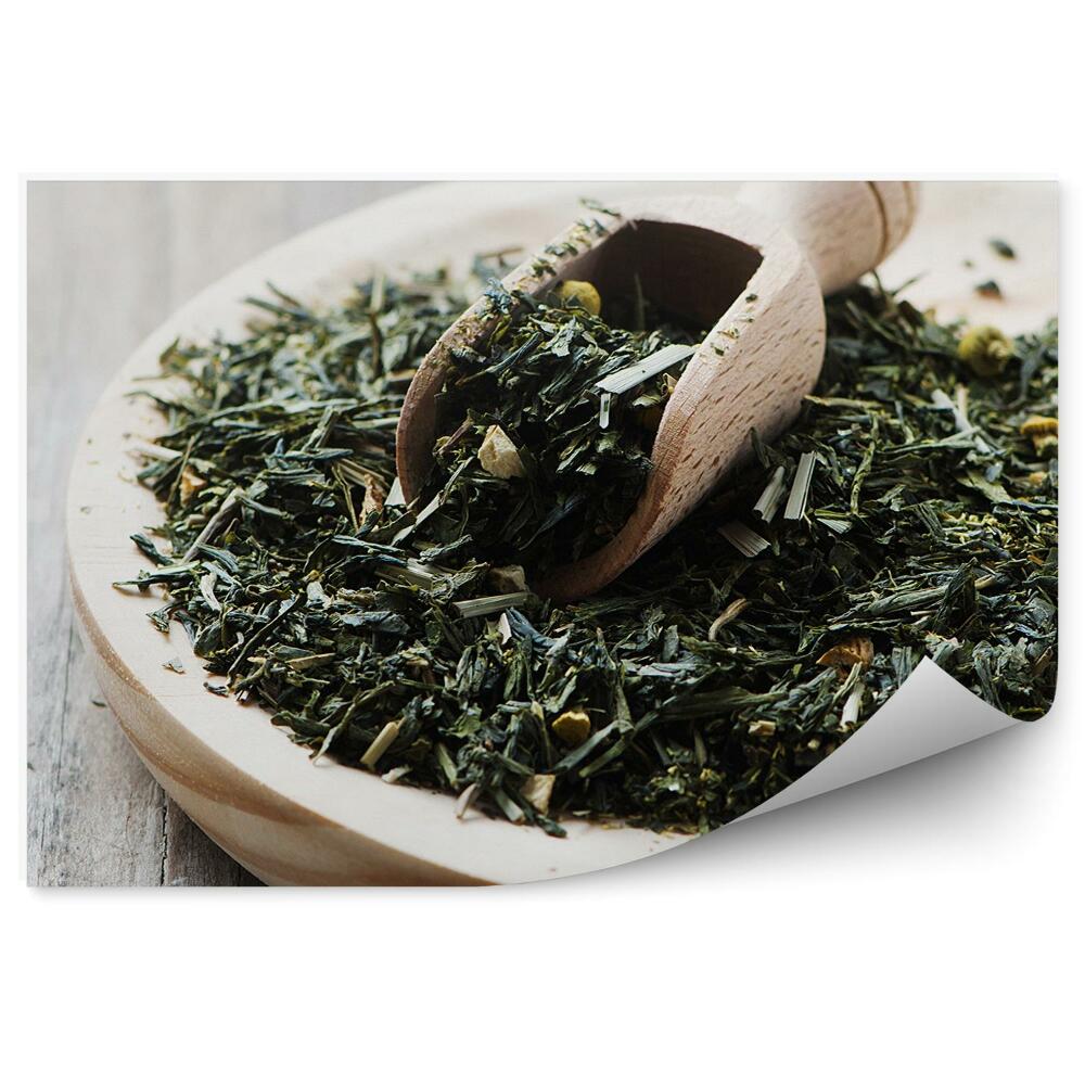 Fototapeta Zielona herbata suszone liście drewniane naczynie stół