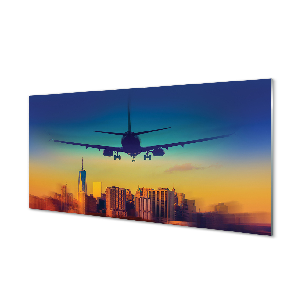 Obraz na szkle Samolot nad miastem kolorowe niebo