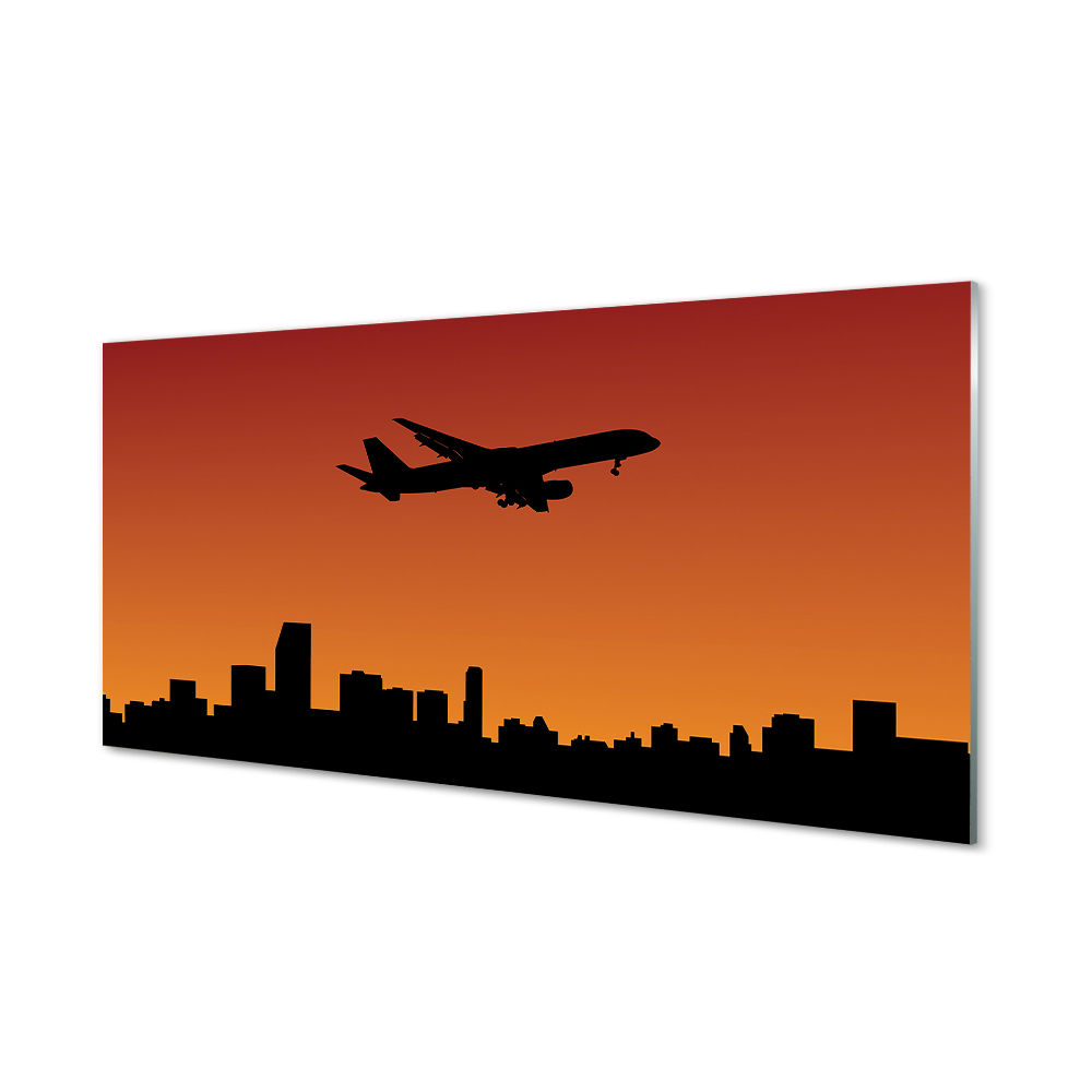 Obraz na szkle Samolot i panorama miasta pomarańczowe tło