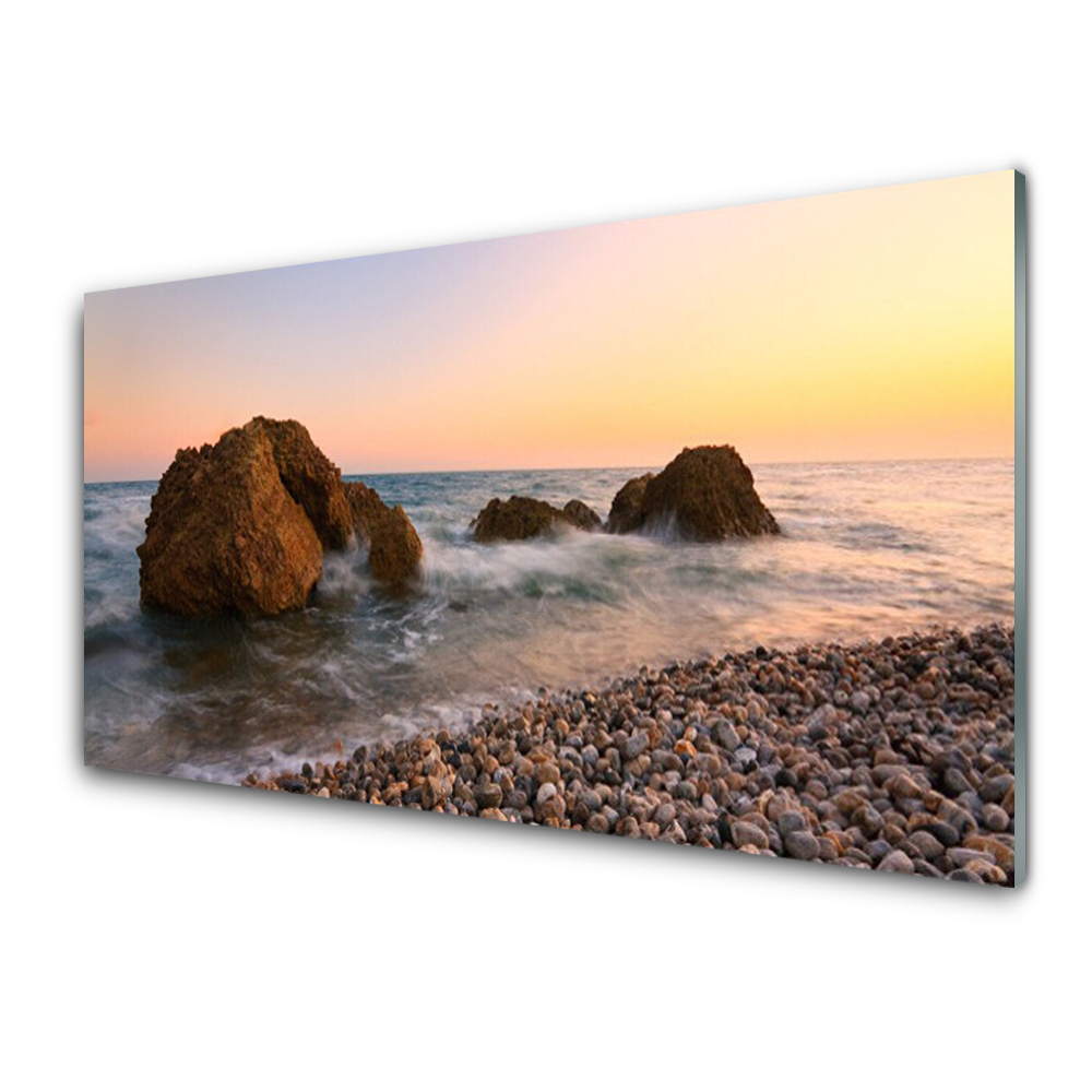 Obraz Szklany Kamienista plaża i morze